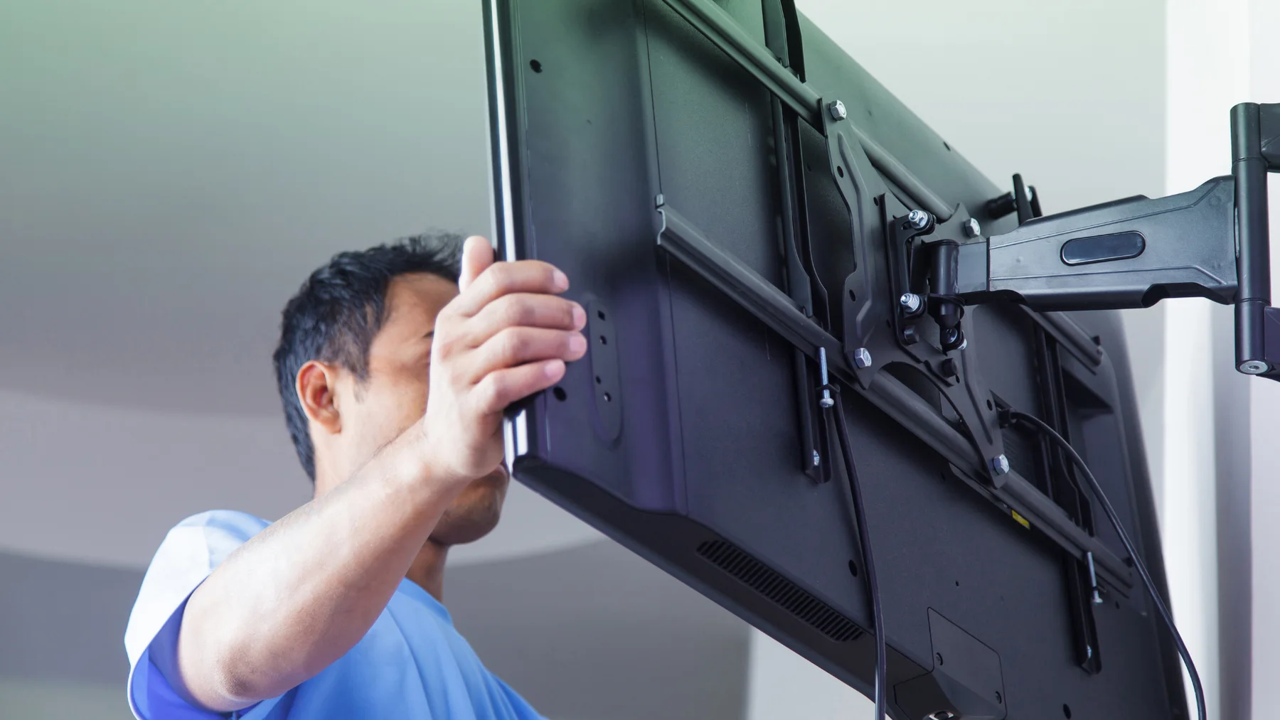 Illustrative image of a television mounted in a finished room