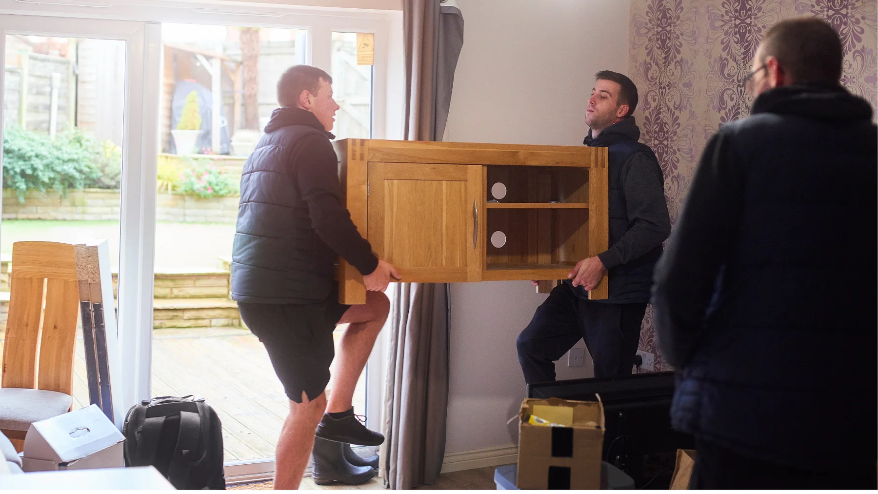 Illustrative image of a chest being moved from a room
